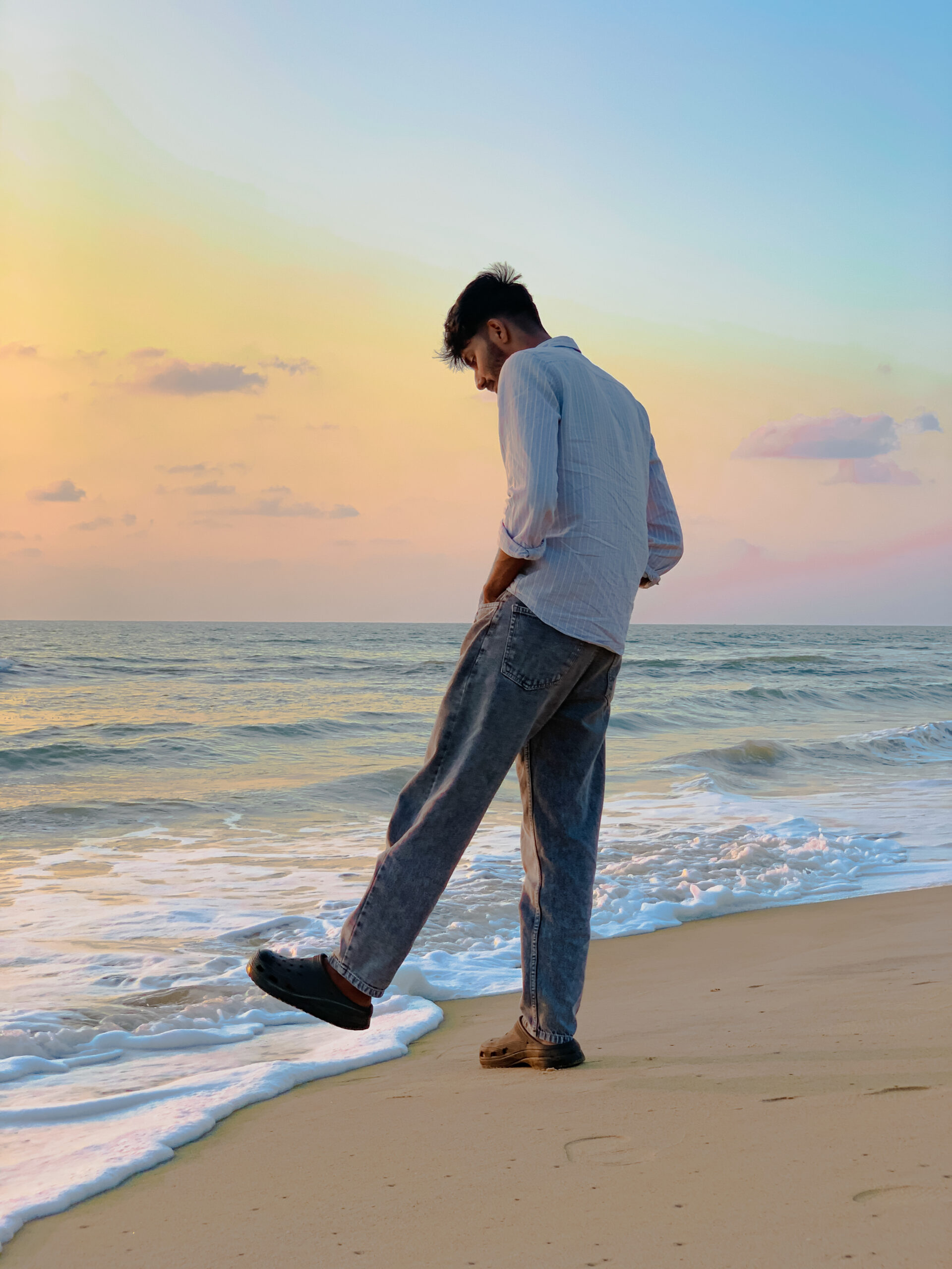 a-boy-standing-on-sea-side